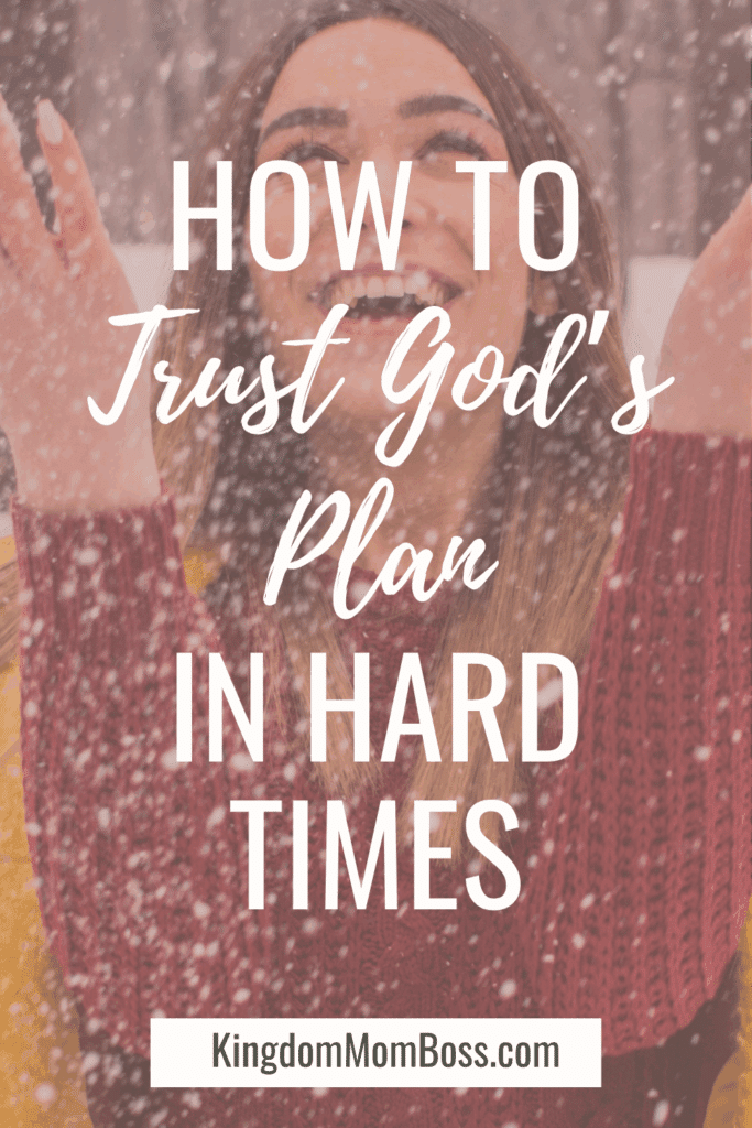 Smiling woman in snowfall, text reads “How to Trust God’s Plan in Hard Times,” Kingdom Mom Boss.