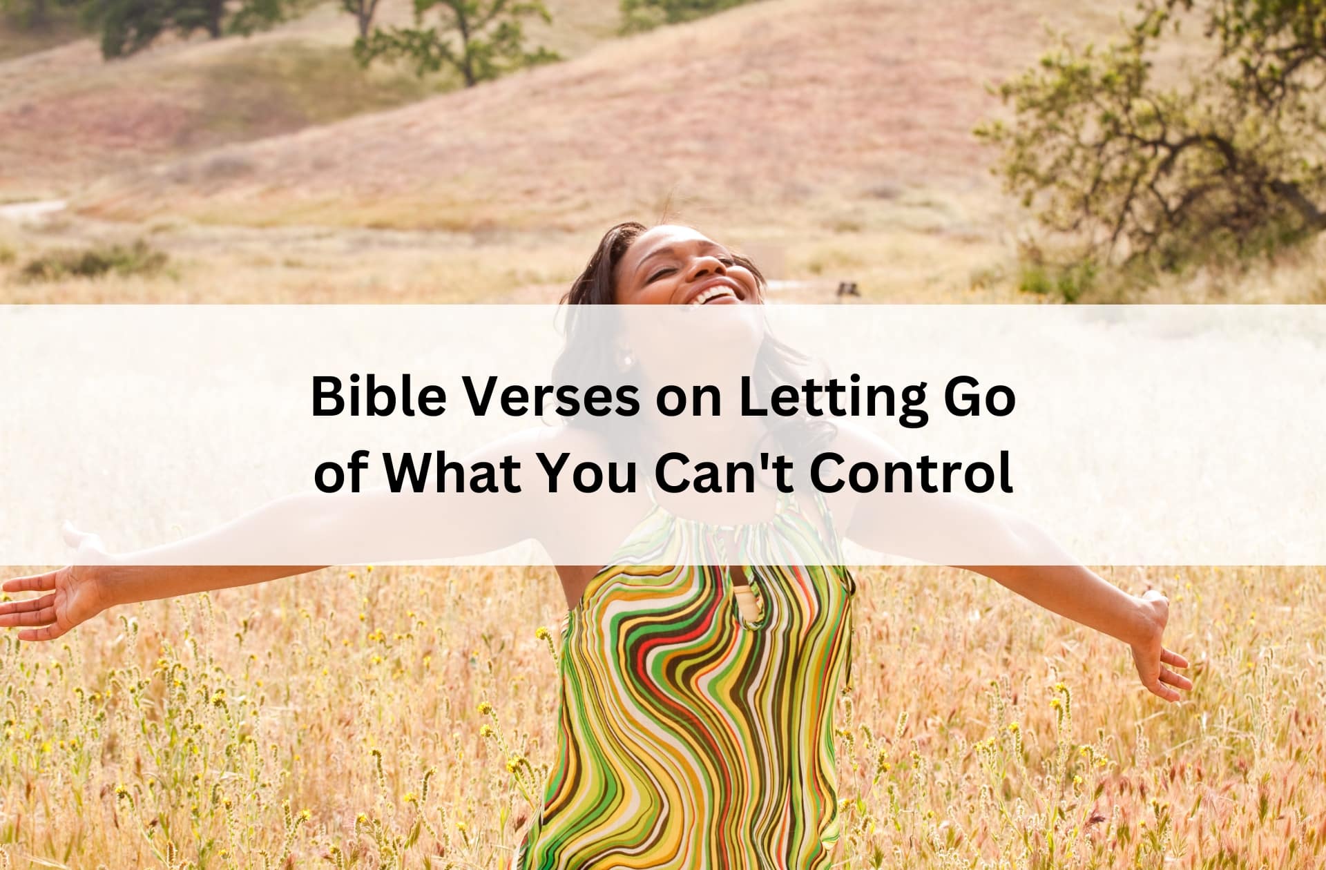 Woman standing in a sunlit field with arms wide open, smiling in freedom, with text overlay: “Bible Verses on Letting Go of What You Can’t Control.”