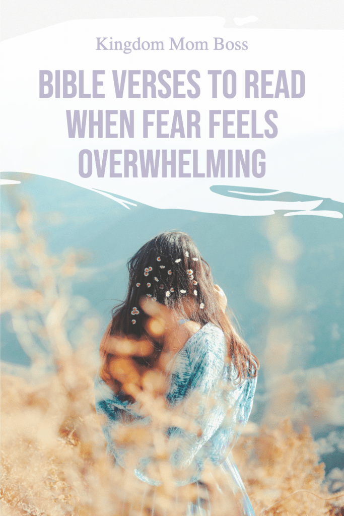 Woman standing in field with flowers in hair with text Bible Verses to Read When Fear Feels Overwhelming, Kingdom Mom Boss