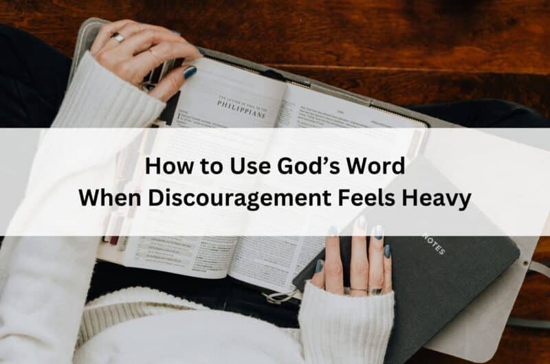Hands holding an open Bible and notebook; overlay text reads “How to Use God’s Word When Discouragement Feels Heavy.”
