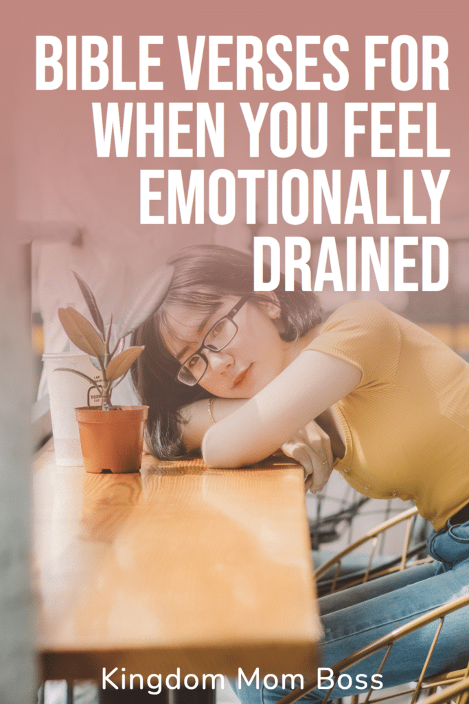 Woman resting her head on a café table beside a small plant with text overlay Bible Verses for When You Feel Emotionally Drained.