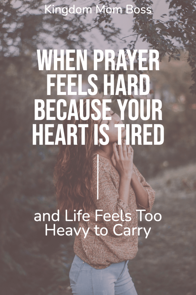 Woman praying outside with text overlay When Prayer Feels Hard Because Your Heart Is Tired and Life Feels Too Heavy to Carry.