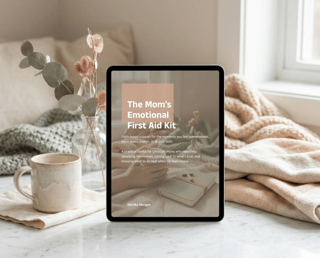 Tablet displaying "The Mom’s Emotional First Aid Kit" beside a coffee mug, cozy blankets, and dried eucalyptus, creating a calm, faith-based self-care scene.