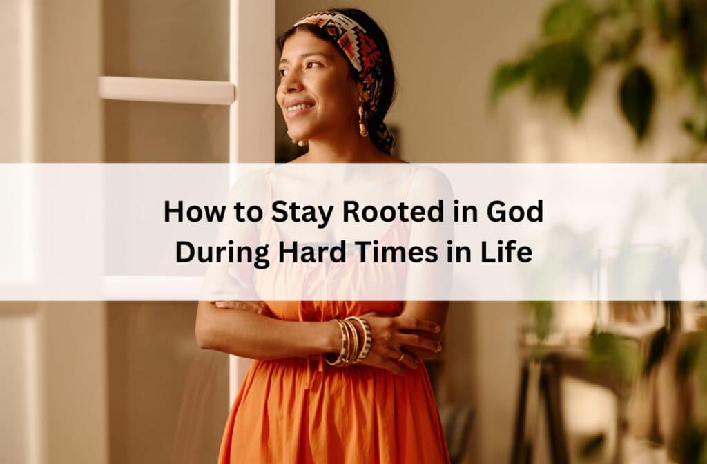 Woman standing by a window with a hopeful smile, symbolizing staying rooted in God through life's challenges with faith, strength, peace, and hope.